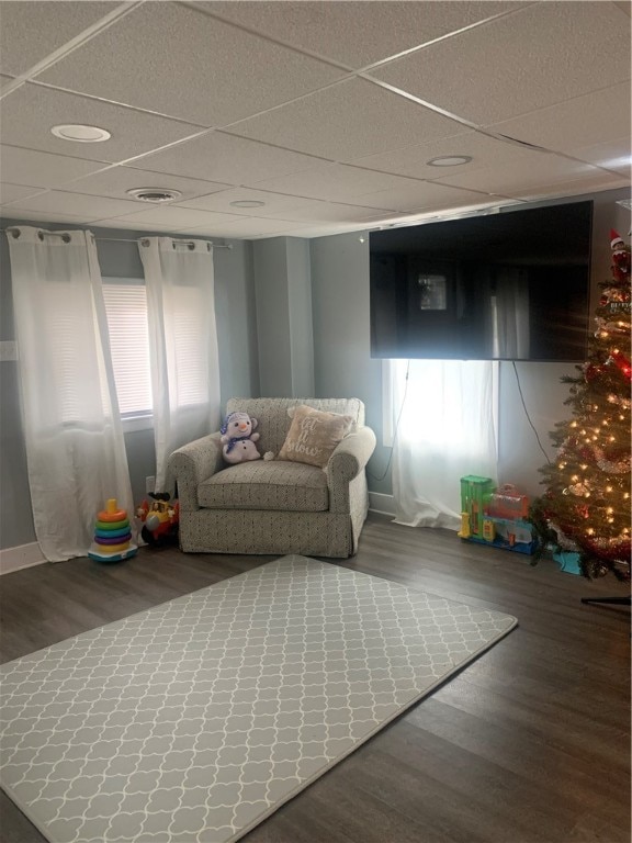 game room featuring a paneled ceiling and hardwood / wood-style flooring