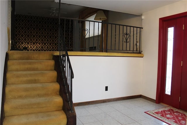 entrance foyer with ceiling fan and light tile patterned floors