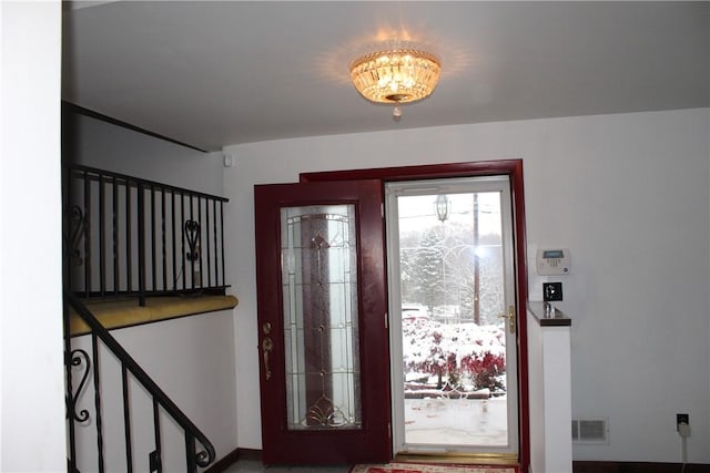 foyer with a notable chandelier