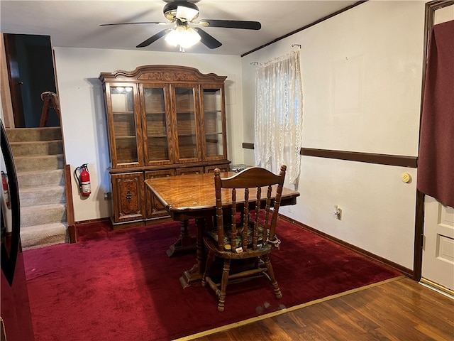 dining space with dark hardwood / wood-style floors and ceiling fan