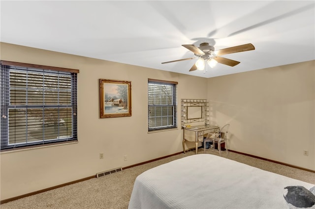 bedroom featuring ceiling fan and carpet floors