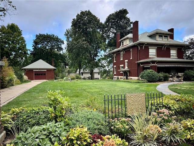 view of yard with an outbuilding, fence, and a garage