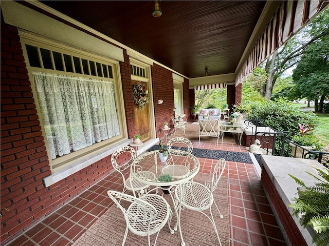 view of patio featuring a porch