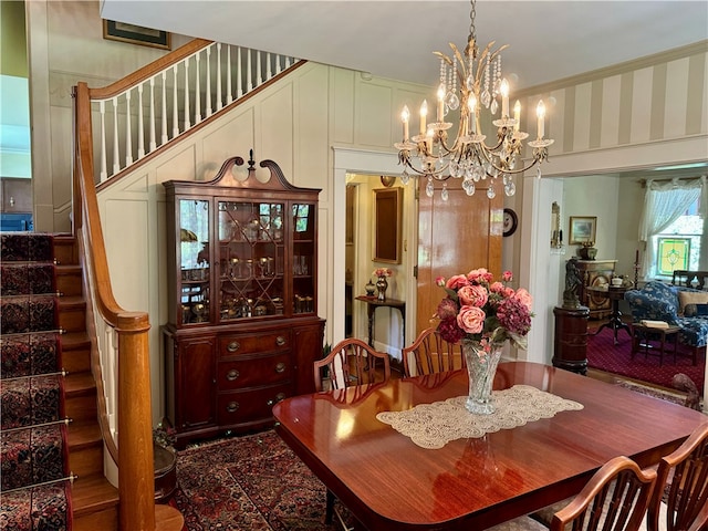 dining area featuring a notable chandelier