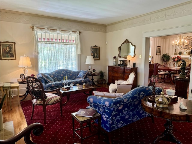 living room with hardwood / wood-style floors and a notable chandelier