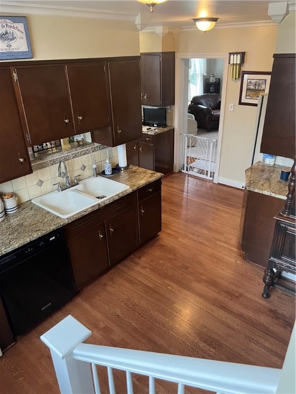 kitchen featuring black dishwasher, dark hardwood / wood-style floors, tasteful backsplash, and sink