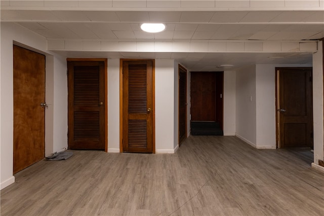 interior space with hardwood / wood-style flooring and two closets