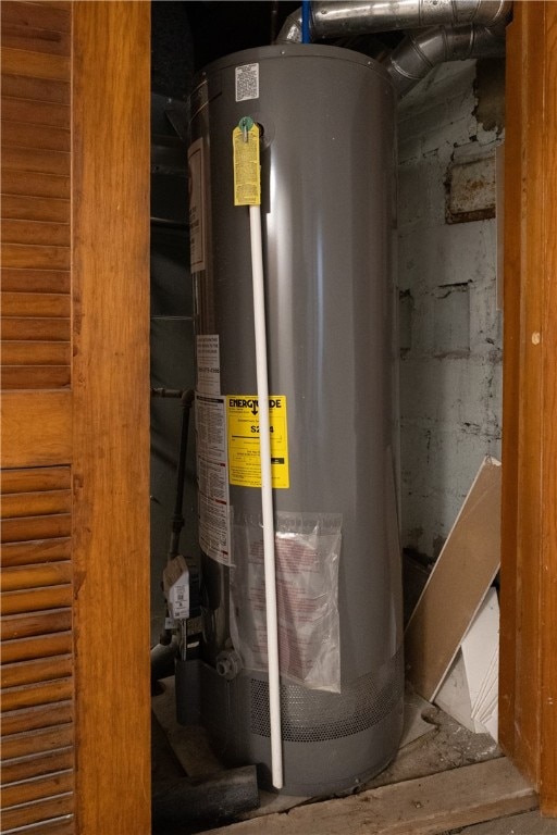 utility room featuring water heater