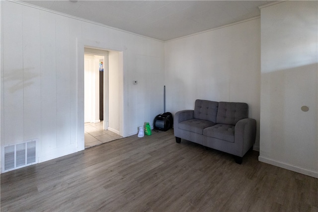 living room featuring hardwood / wood-style floors and ornamental molding