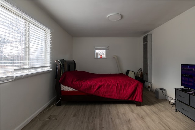 bedroom with light hardwood / wood-style flooring