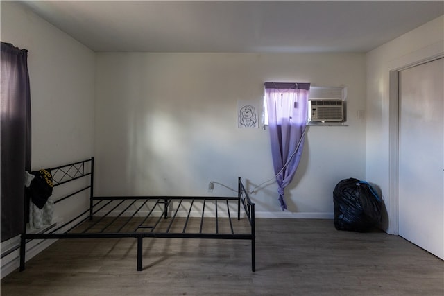 bedroom with hardwood / wood-style floors