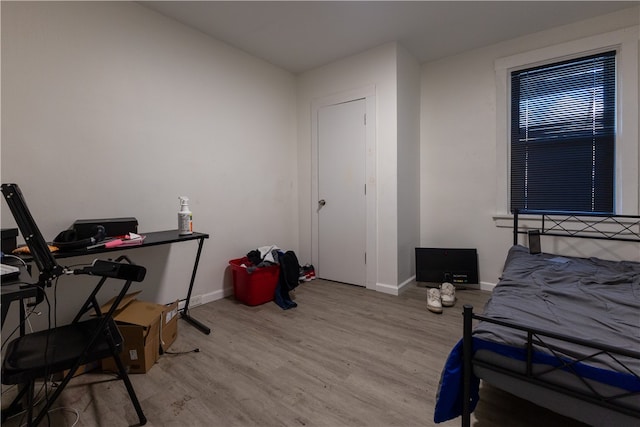 bedroom with light hardwood / wood-style flooring