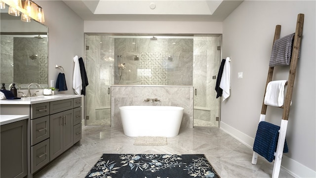 bathroom with shower with separate bathtub and vanity