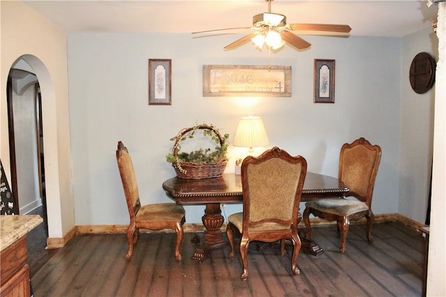 dining room featuring ceiling fan and dark hardwood / wood-style flooring