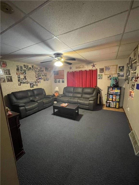 carpeted living room with a paneled ceiling and ceiling fan