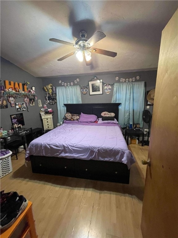 bedroom featuring hardwood / wood-style flooring and ceiling fan