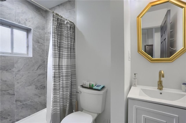 full bathroom with shower / bathtub combination with curtain, vanity, and toilet