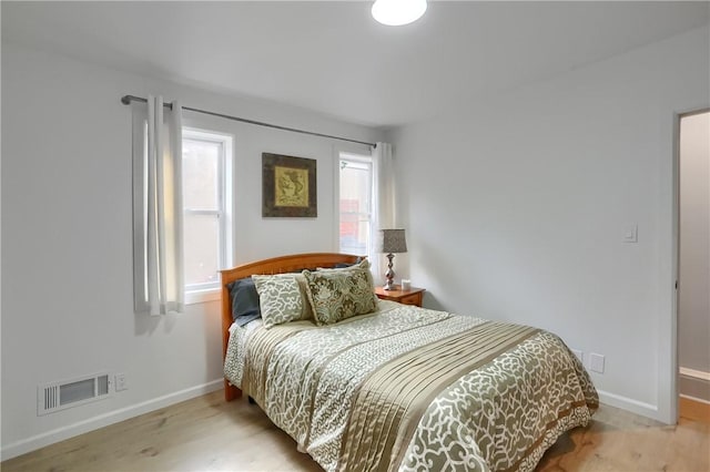 bedroom with light wood-type flooring