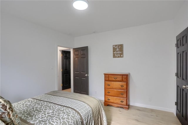 bedroom with light hardwood / wood-style flooring