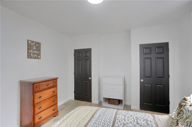 bedroom with light hardwood / wood-style floors