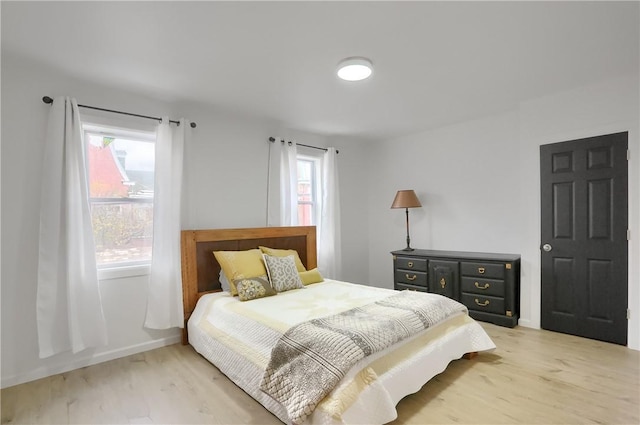 bedroom with light wood-type flooring