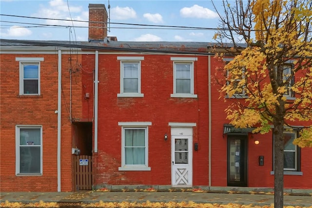 1402 Bingham St, South Side, PA 15203 - townhome / multi-family property featuring a chimney and brick siding