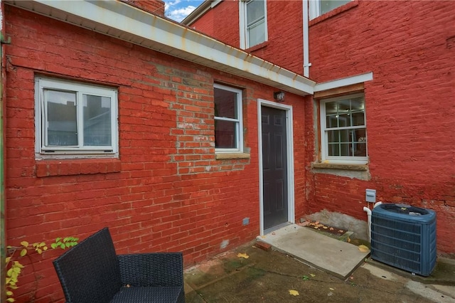 doorway to property featuring central AC