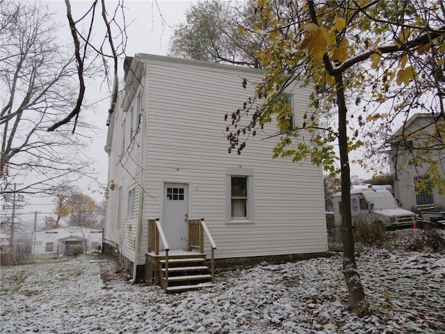 view of snow covered house