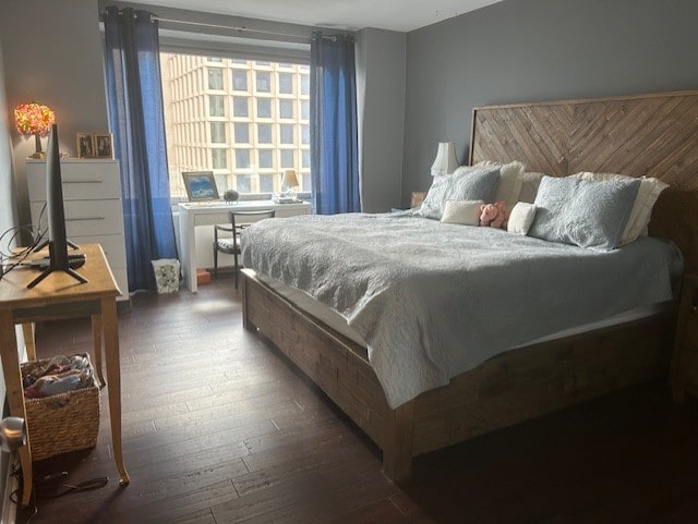 bedroom featuring dark wood finished floors