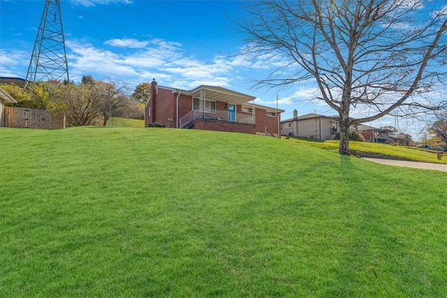 view of yard featuring covered porch