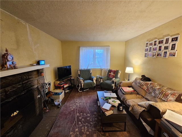 living room with a fireplace and a textured ceiling