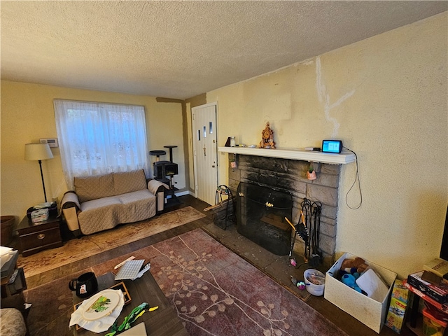 living room featuring a fireplace and a textured ceiling