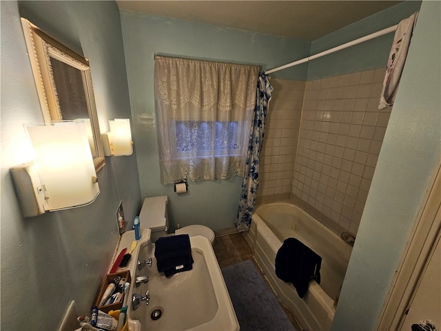 bathroom with shower / bath combination with curtain and toilet