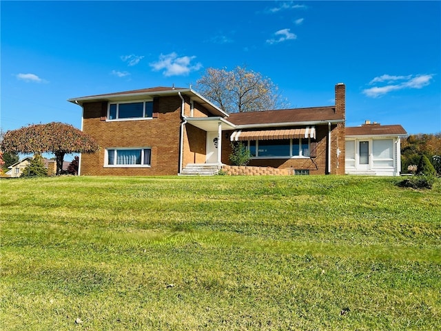 back of house featuring a yard