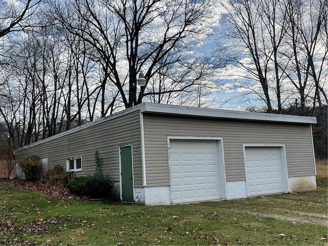 garage with a yard