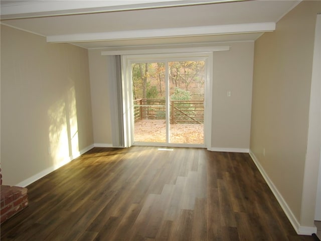 unfurnished room featuring beamed ceiling and dark hardwood / wood-style floors