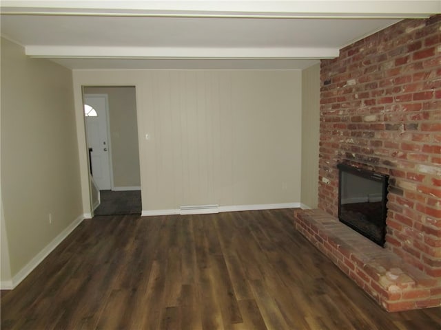 unfurnished living room with a fireplace, dark hardwood / wood-style flooring, and beamed ceiling