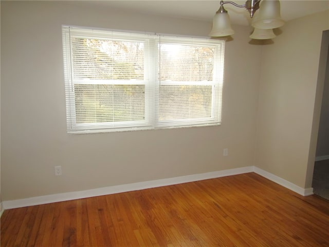 unfurnished dining area featuring hardwood / wood-style floors