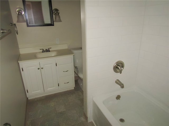 full bathroom with vanity, toilet, and shower / washtub combination