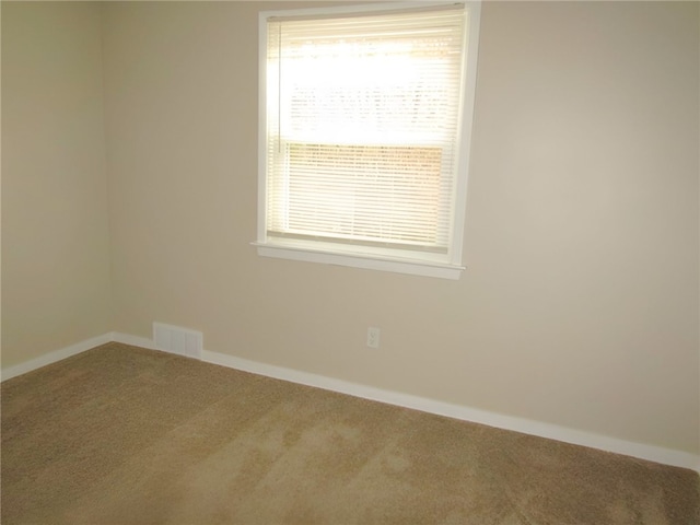 empty room with carpet flooring