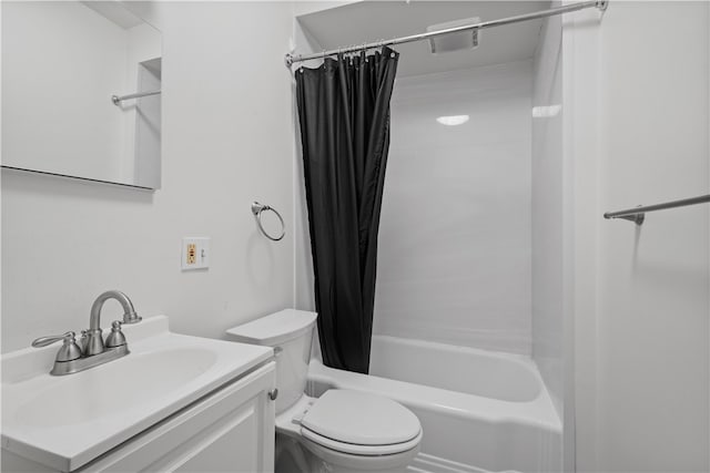 full bathroom featuring shower / tub combo with curtain, vanity, and toilet