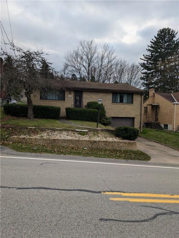 630 Agnew Rd, Baldwin Boro, PA 15227 - view of front of house with concrete driveway, brick siding, and a garage
