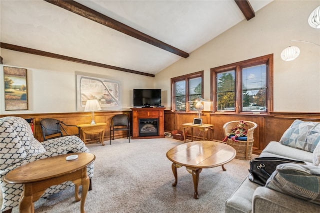 living room with carpet, lofted ceiling with beams, and wooden walls