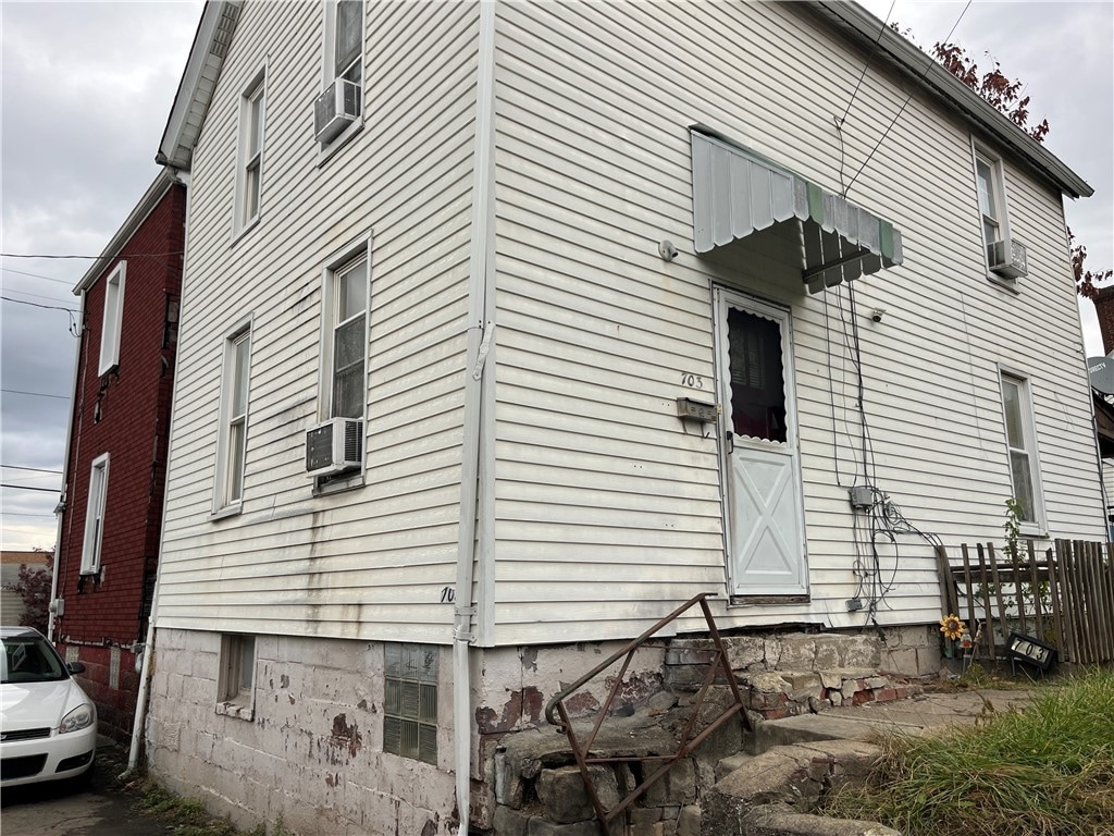 view of side of property featuring cooling unit