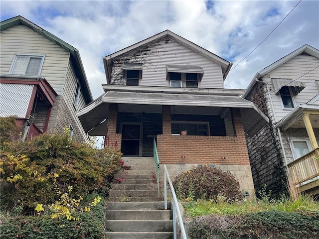 511 Vermont Ave, Glassport, PA 15045 - view of front facade featuring brick siding, covered porch, and stairs