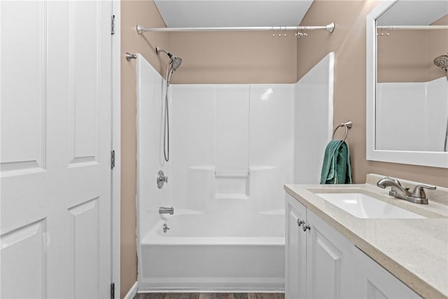 bathroom featuring vanity and bathing tub / shower combination