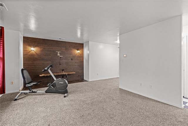 exercise room with wooden walls