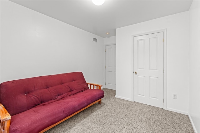 living area featuring carpet flooring