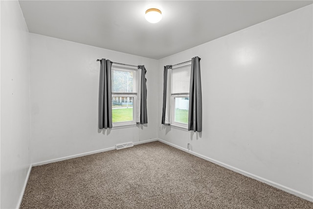 unfurnished room featuring carpet