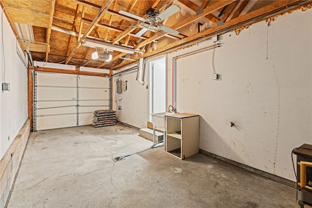 garage featuring ceiling fan, sink, and a garage door opener